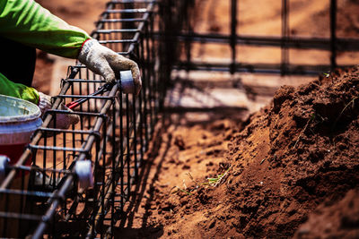 Close-up of man working at construction site