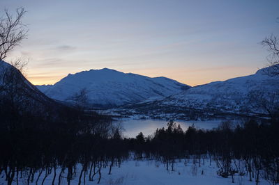 Scenic view of mountains against sky during winter