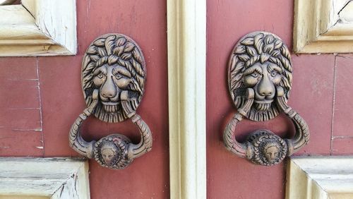 Close-up of statue against door