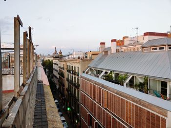 Street amidst buildings against sky