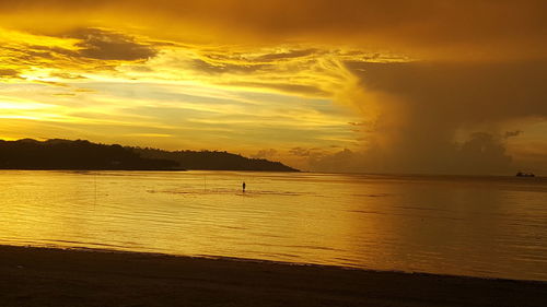 Scenic view of sea against dramatic sky