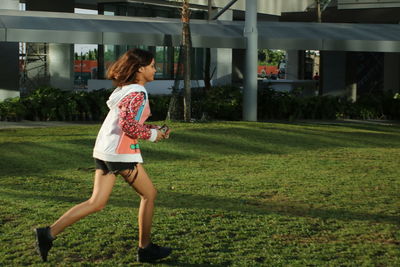 Full length of woman standing on field