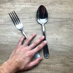 Close-up of man hand on table