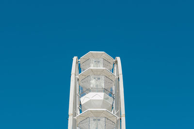 Low angle view of building against clear blue sky