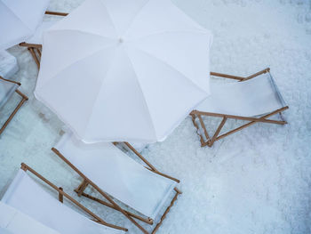 High angle view of paper on snow covered field