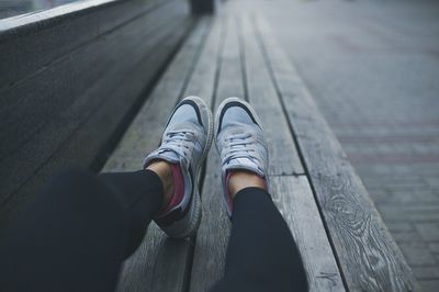 Low section of woman on bench