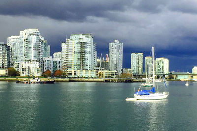 Cityscape against cloudy sky