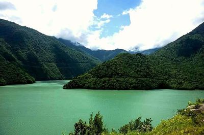 Scenic view of lake with mountains in background