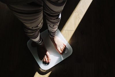 Low section of man standing on floor