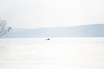 Fishing with a fishing rod in the center of the sea of galilee