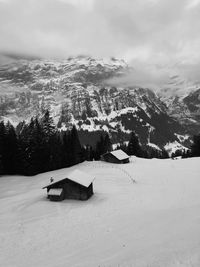 Scenic view of snow covered mountains against sky