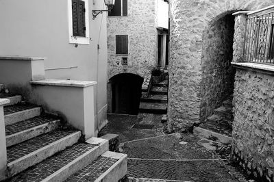 Empty alley amidst buildings