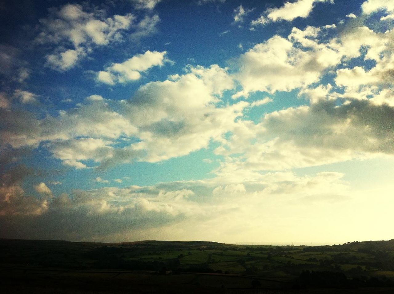 sky, tranquil scene, landscape, tranquility, scenics, beauty in nature, cloud - sky, nature, horizon over land, cloud, cloudy, field, idyllic, non-urban scene, remote, silhouette, outdoors, blue, non urban scene, no people