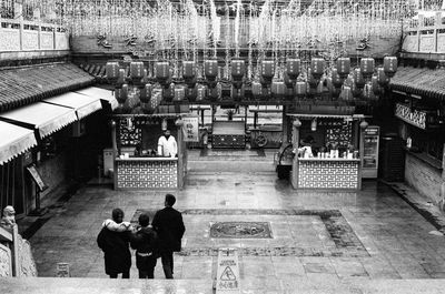 High angle view of people sitting outside temple