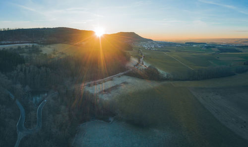 Scenic view of landscape against sky during sunset