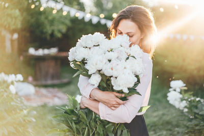 Young woman holding bouquet