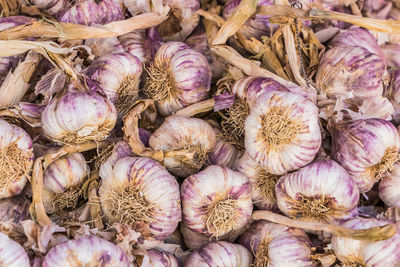 Full frame shot of garlic for sale in market