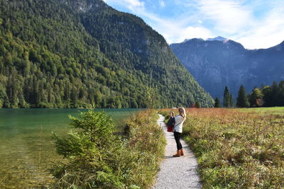 Woman photographing mountains