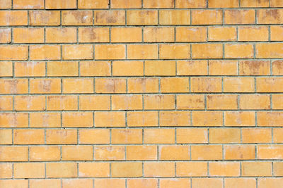 Orange brick wall, old vintage dirty brick wall