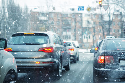 Traffic on road in city during winter