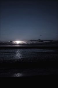 Scenic view of sea against sky at night
