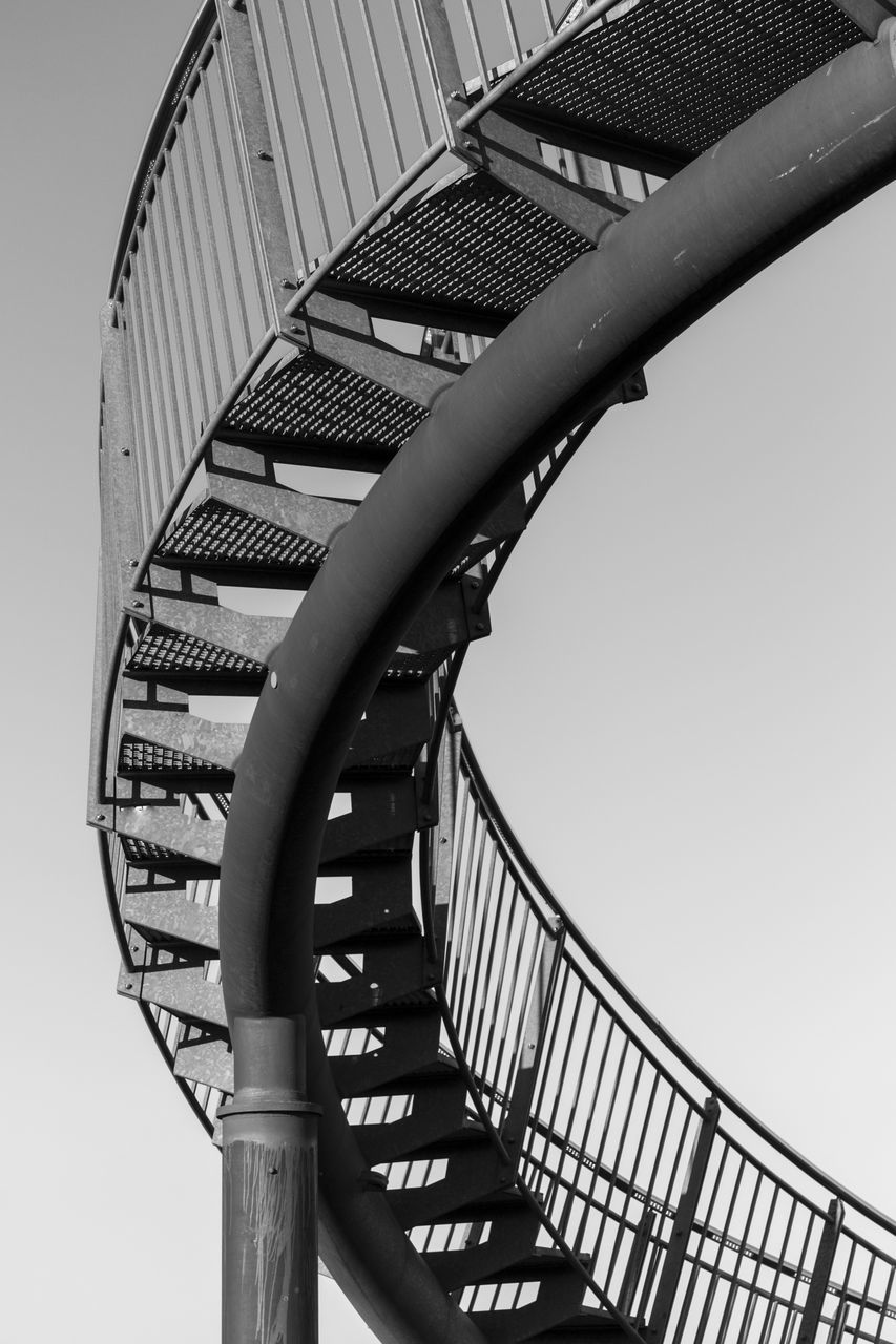 LOW ANGLE VIEW OF SPIRAL STAIRS