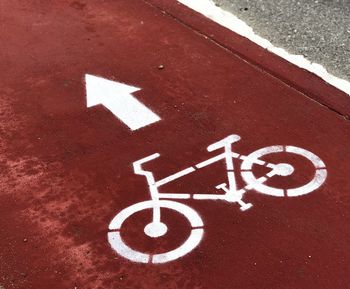 High angle view of arrow sign on road