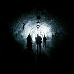 People walking in tunnel