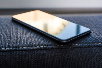 High angle view of smart phone on table