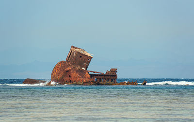 Scenic view of rusty boat against clear sky