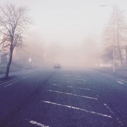 Car on street during foggy weather