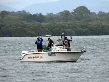 People on boat sailing in sea