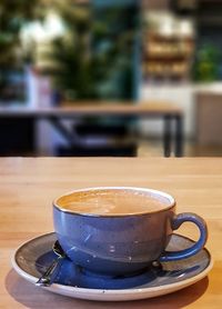 Close-up of coffee cup on table