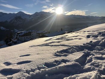 Scenic view of snowcapped mountains against sky