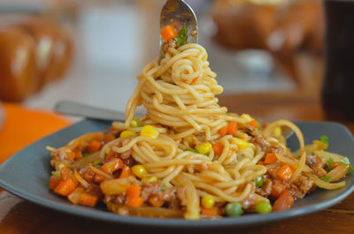 Close-up of pasta served in plate on table