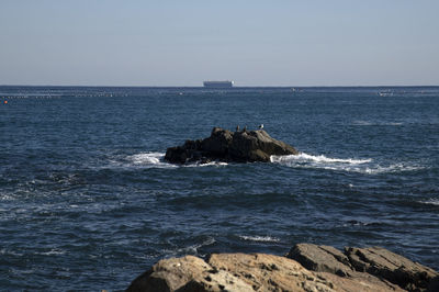 Scenic view of sea against clear sky