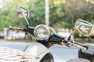 Motor scooter parked on road