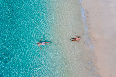 High angle view of man swimming in sea