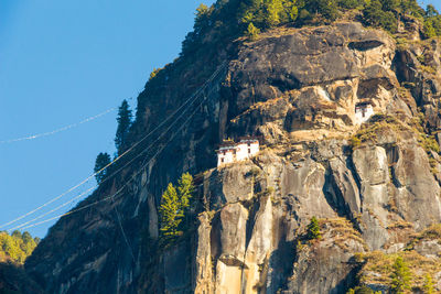 Low angle view of rock formations against sky