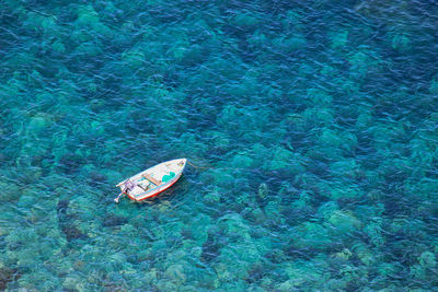 High angle view of boat floating on sea