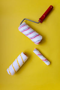 High angle view of bread in container on yellow table