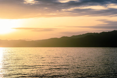 Scenic view of sea against sky during sunset