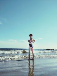 Woman standing on beach