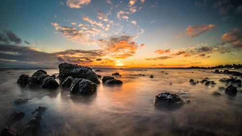 Scenic view of sea at sunset