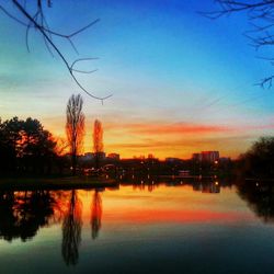 Scenic view of lake at sunset