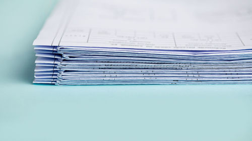 Close-up of papers over white background