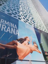 Low angle view of woman with text on water