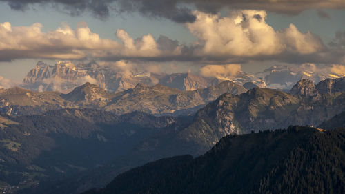 Scenic view of mountains against sky at sunset