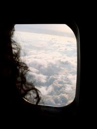 Aerial view of landscape against cloudy sky