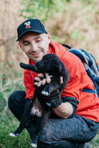 Portrait of smiling woman with dog